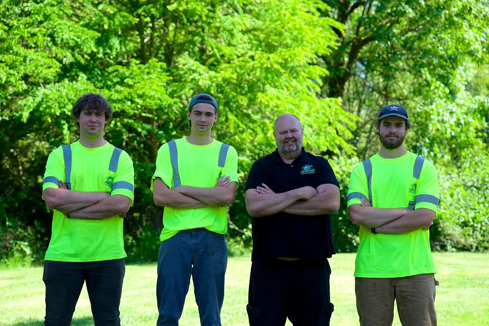 The Forest Trunk family crew standing together on a lawn